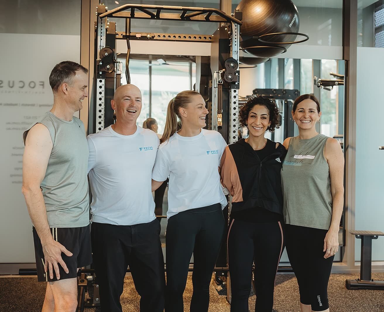 A personal training session at Focus Health & Fitness Norwest, featuring personal trainers and clients enjoying their health and fitness time at the Bella Vista Studio.