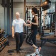 Personal Trainer Supporting Client During Balance and Stability Training on Bosu Ball at Focus Health & Fitness in Norwest Nsw