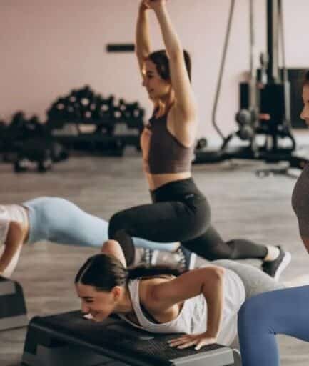 Women performing step push-ups and lunges during a group fitness session at Focus Health & Fitness in Norwest, NSW.
