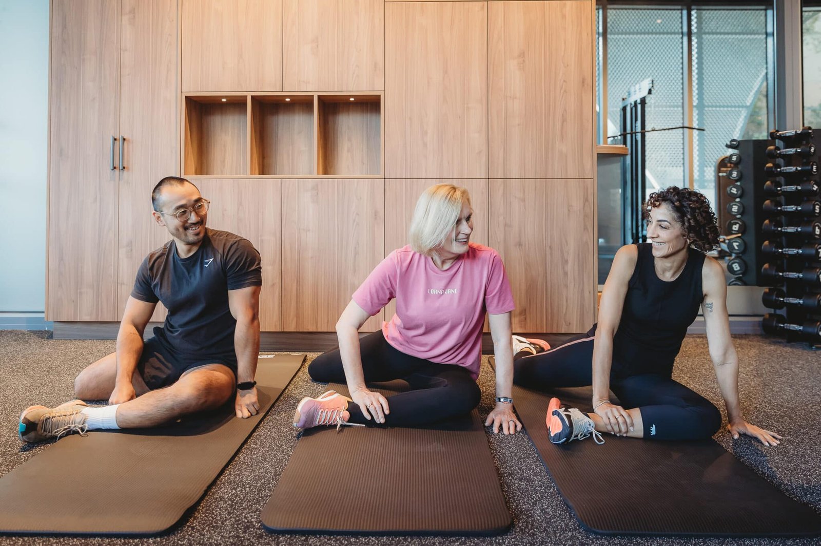 Clients Enjoying a Guided Group Stretch Session at Focus Health & Fitness in Norwest, Promoting Mobility, Flexibility, and Wellbeing