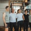 Personal trainers and happy clients in personal training session at Focus Health & Fitness Norwest, featuring clients improving strength and mobility with expert coaching