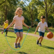Children playing outdoors in the Hills District during school holidays, skipping rope and playing basketball in a park near Castle Hill.