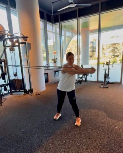 Client performing standing cable core rotation exercise at focus health and fitness personal training studio in norwest, Bella Vista, Castle Hill, hills district
