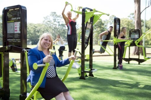 Outdoor fitness park in the Hills District with exercise equipment, gum trees, and open grassy space for community workouts