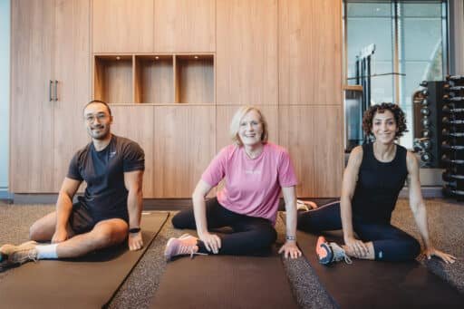 Desk worker experiencing lower back pain in Norwest Hills District